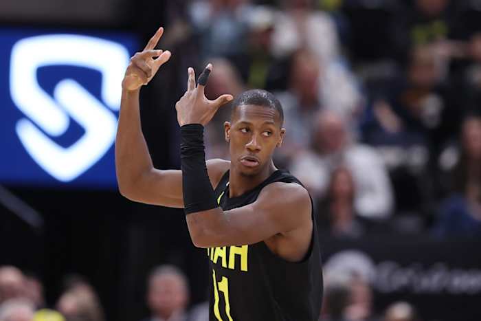 Utah Jazz guard Kris Dunn (11) reacts after making a three point shot against the San Antonio Spurs in the second quarter at Vivint Arena.